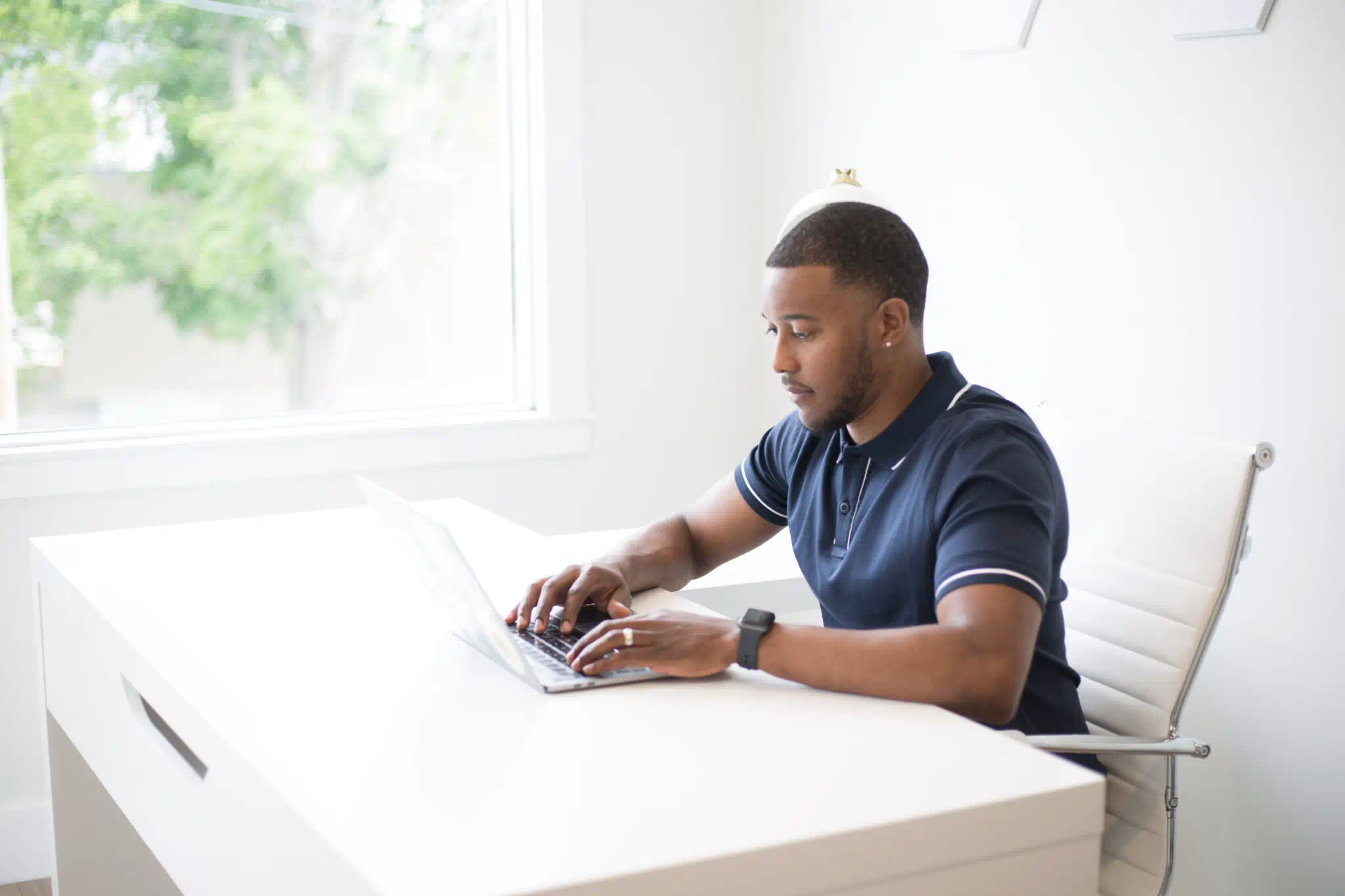 Team member working on a laptop